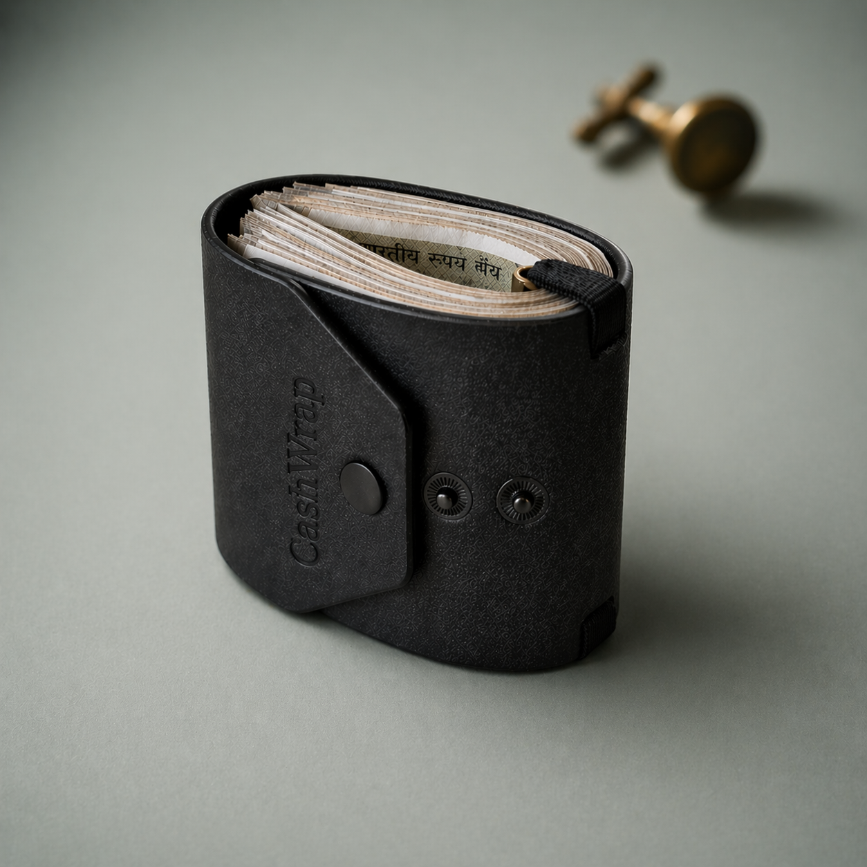Black leather cash wrap with money on a gray background