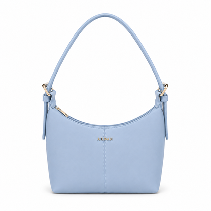 A light blue leather shoulder bag with a single top handle, gold-tone hardware, and the brand name 'ASPAR' in gold lettering on the front, set against a plain white background.