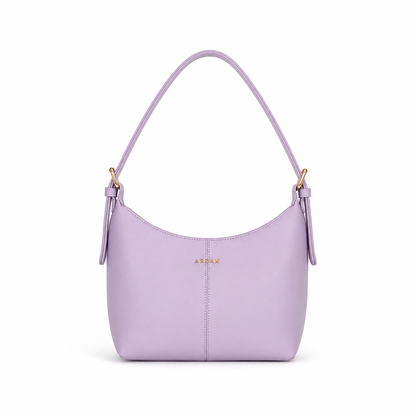 A light purple leather shoulder bag with a curved top, gold-tone hardware, and the brand name 'ARDAK' in gold on the front, set against a plain white background.