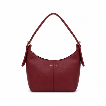 A burgundy leather shoulder bag with a single top handle, gold-tone hardware, and the brand name 'ARDAN' printed in gold on the front, set against a plain white background.