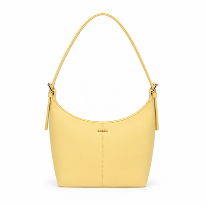 A light yellow leather shoulder bag with a single top handle, gold-tone hardware, and the brand name 'ABIAN' embossed on the front, set against a plain white background.