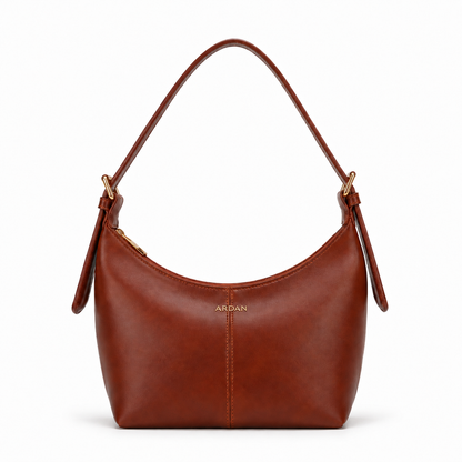 A brown leather shoulder bag with a curved top, a single shoulder strap, and gold-tone hardware, shown on a plain white background. The brand name 'ARGAN' is printed in gold near the center.